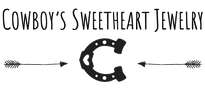 Logo for 'Cowboy's Sweetheart Jewelry' featuring a horseshoe and arrows on a white background.