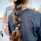 Amy with braided hair wearing Hair Tie with Horshoe shape