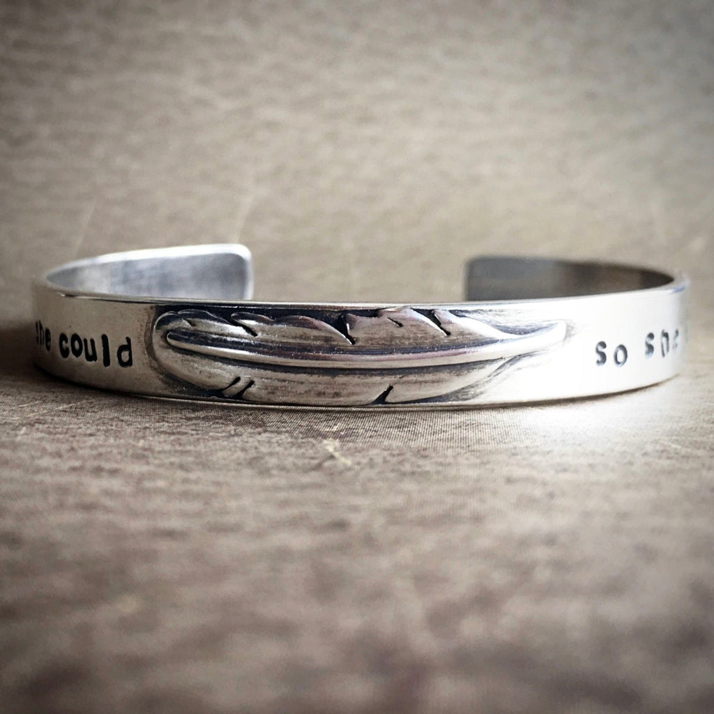 Silver bracelet with she believe she could