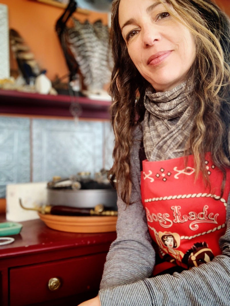 Amy wearing a red apron with 'Boss Lady' text 